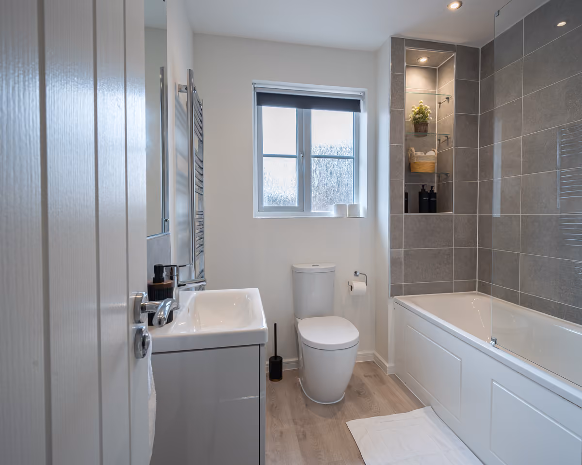 Family bathroom with bath and vanity storage