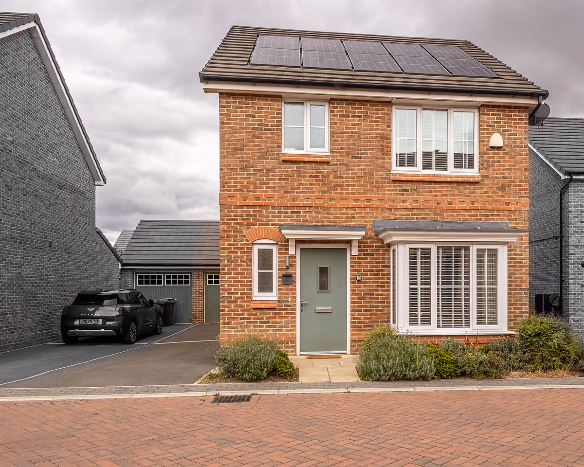 Beamshaw Way front exterior with driveway parking and solar panels